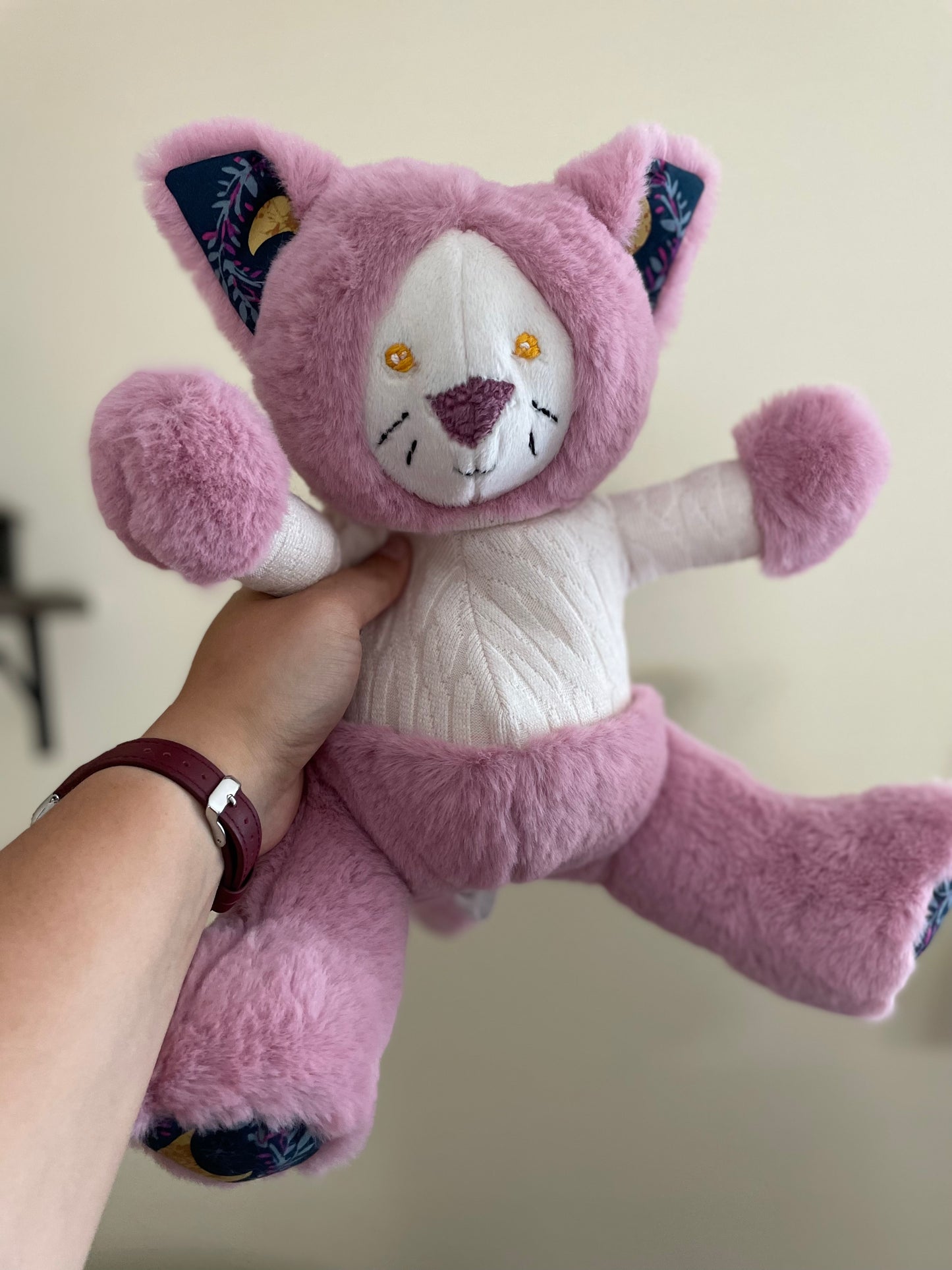 Pink Cat in an Ivory Knit Sweater