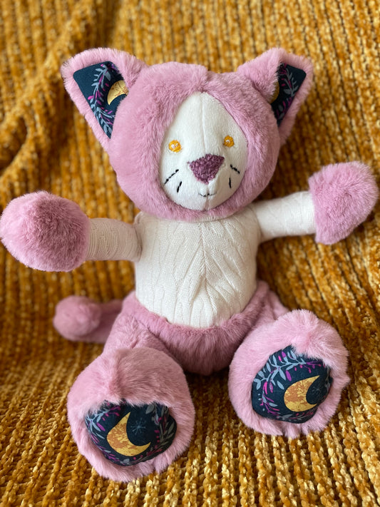 Pink Cat in an Ivory Knit Sweater